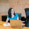 A female coach interacting with a mentee