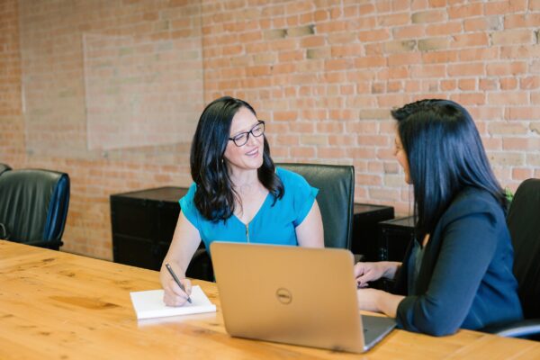 A female coach interacting with a mentee